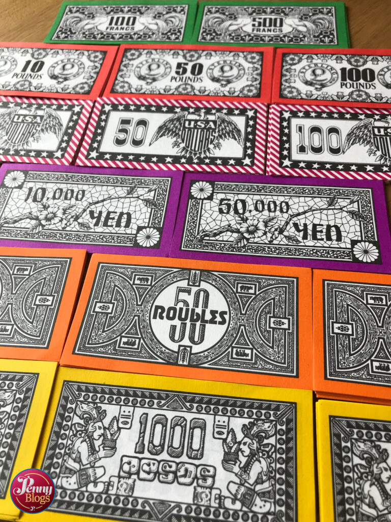 A selection of different currency bank notes from the Vintage Board Game Travel Go