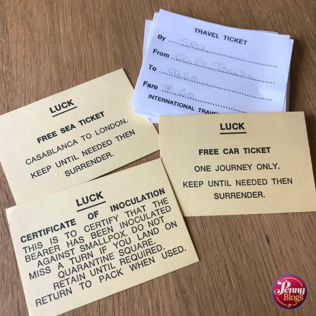 Luck cards and travel Tickets from vintage board game Travel Go