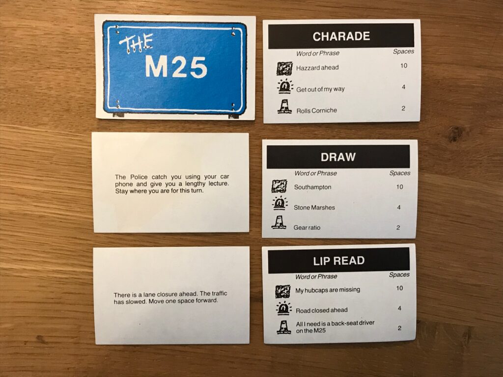 Five example M25 cards showing two where players are given instructions as to how to move - or not. The other three are an example of the lip read, draw and mime cards.