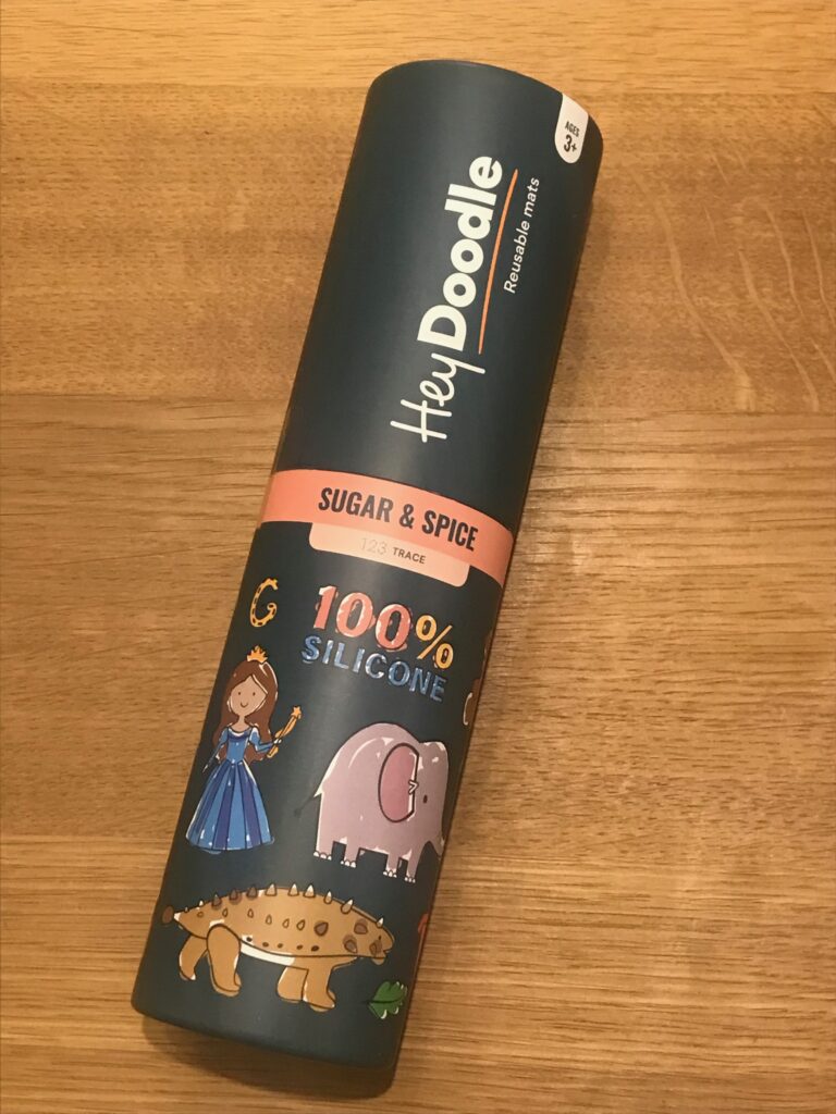A sturdy cardboard tube containing a Hey Doodle mini mat