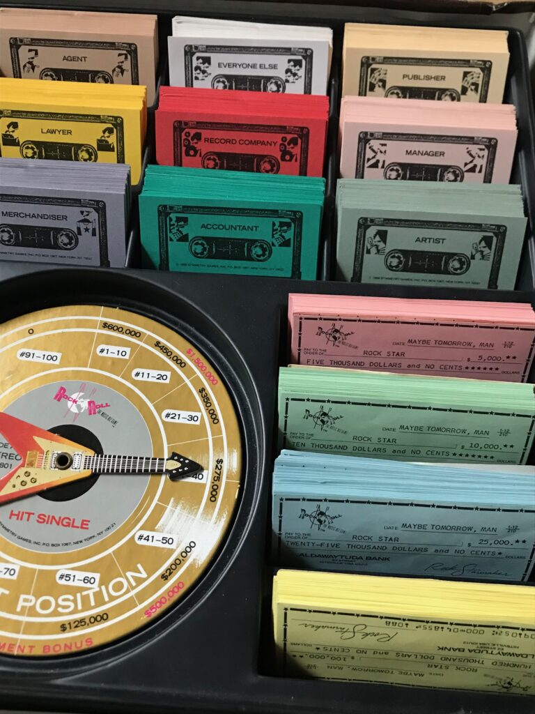 The cassette situation cards, cheques and radio hit single spinner.