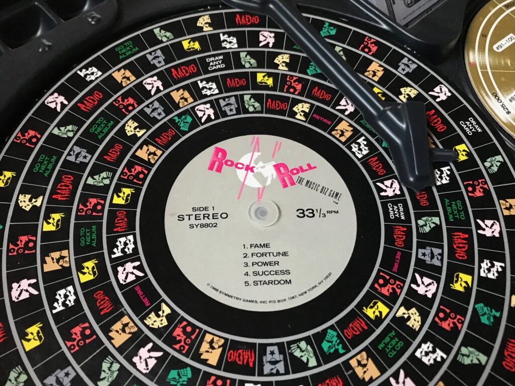 Close up of the spinning album showing teh five grooves and all the different spaces players can stop the needle on.